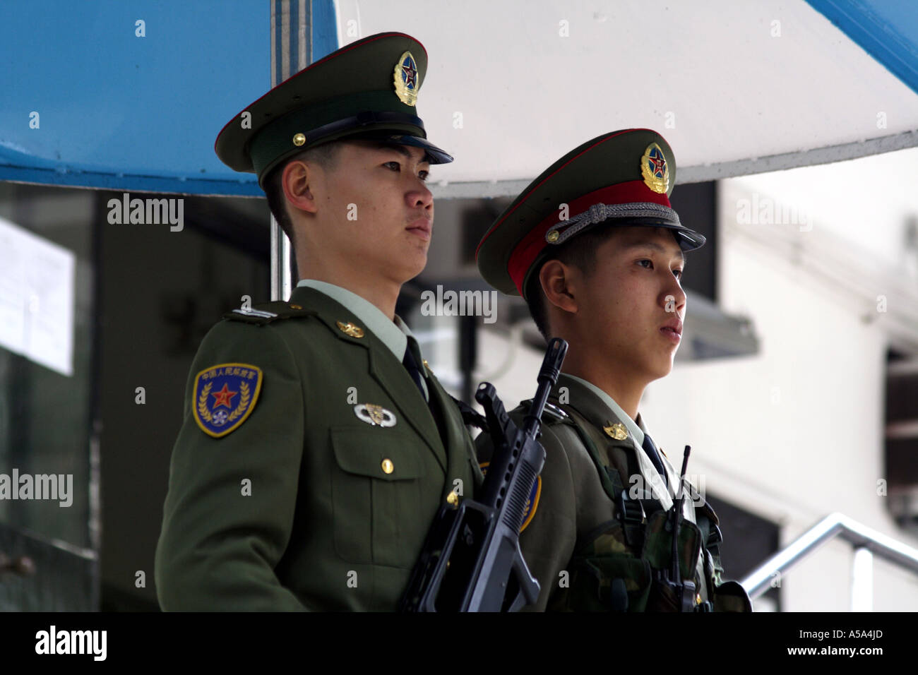 Chinese Military Guards stand watch with an automatic assault rifle Stock Photo