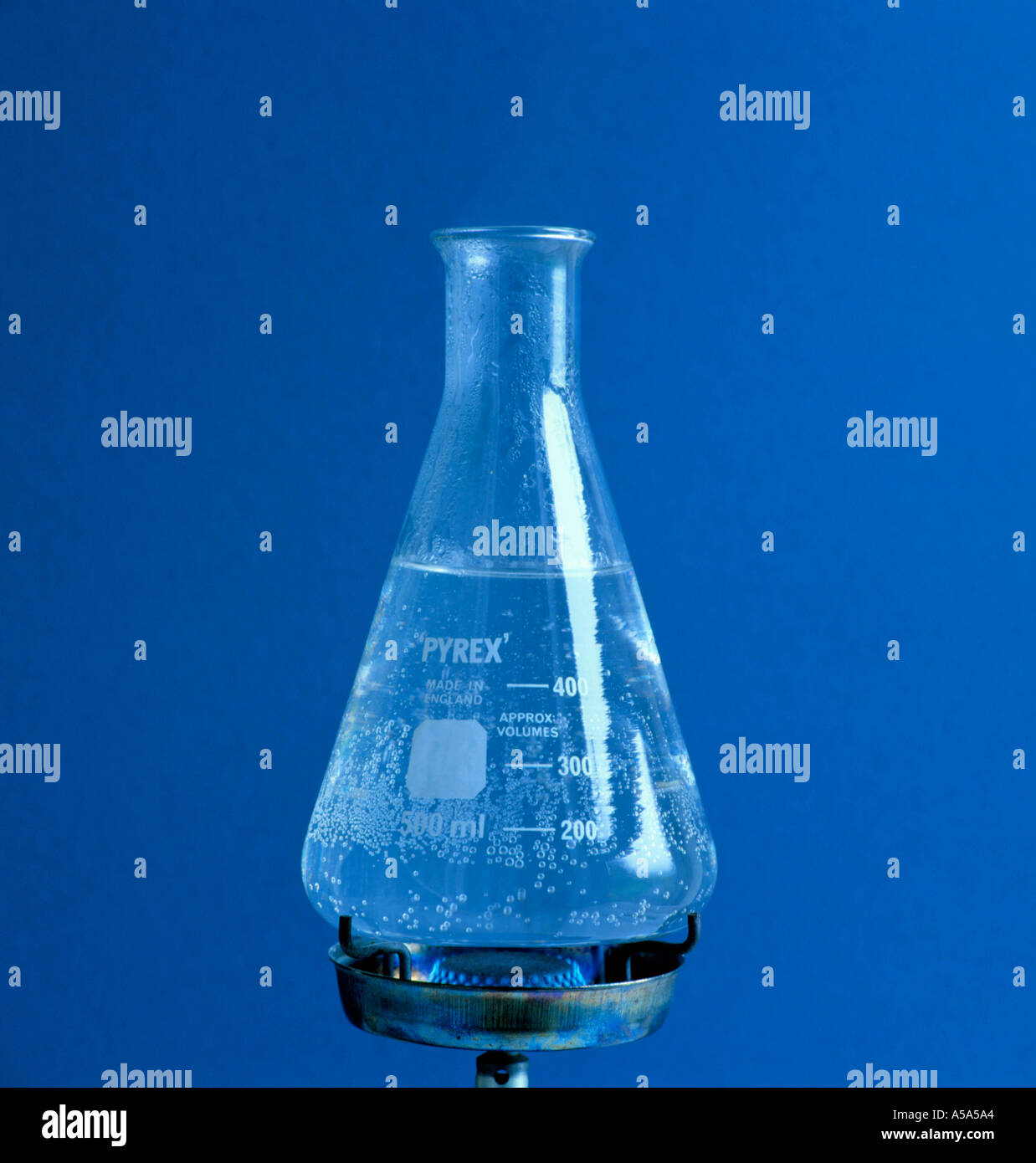 Water about to boil in a conical Pyrex flask Stock Photo Alamy