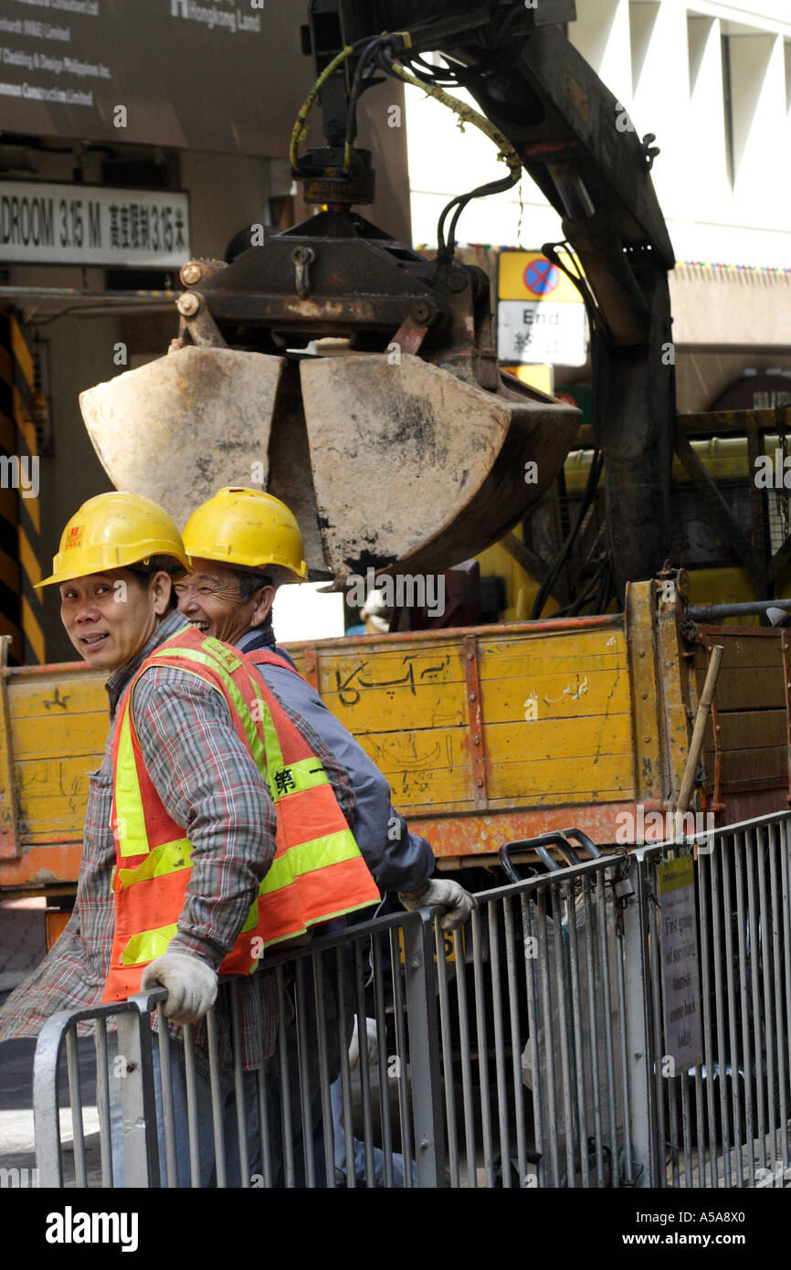 Constuction workers at a site in Wan Chai district, Hong Kong Stock Photo