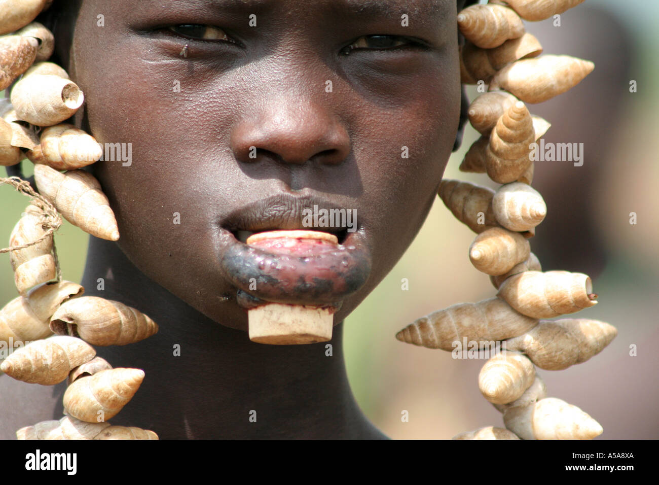Mursi tribe girl with lip plate, Lower Omo Valle, Ethiopia Stock Photo -  Alamy