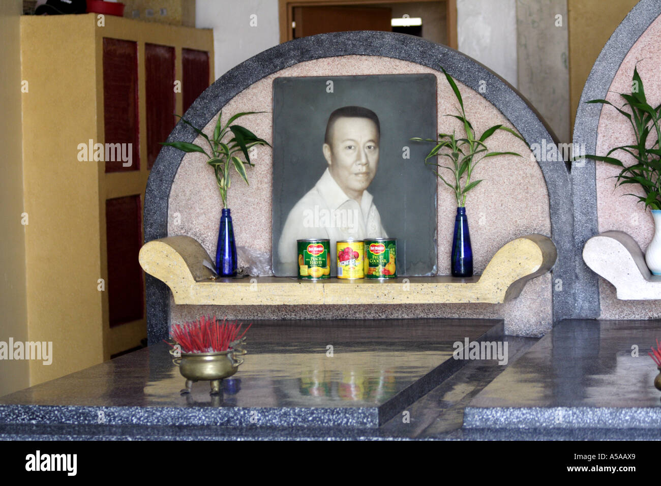 Philippine Islands, Portrait of the dead in an ornate tomb in the Chinese Cemetery, City of the Dead Stock Photo