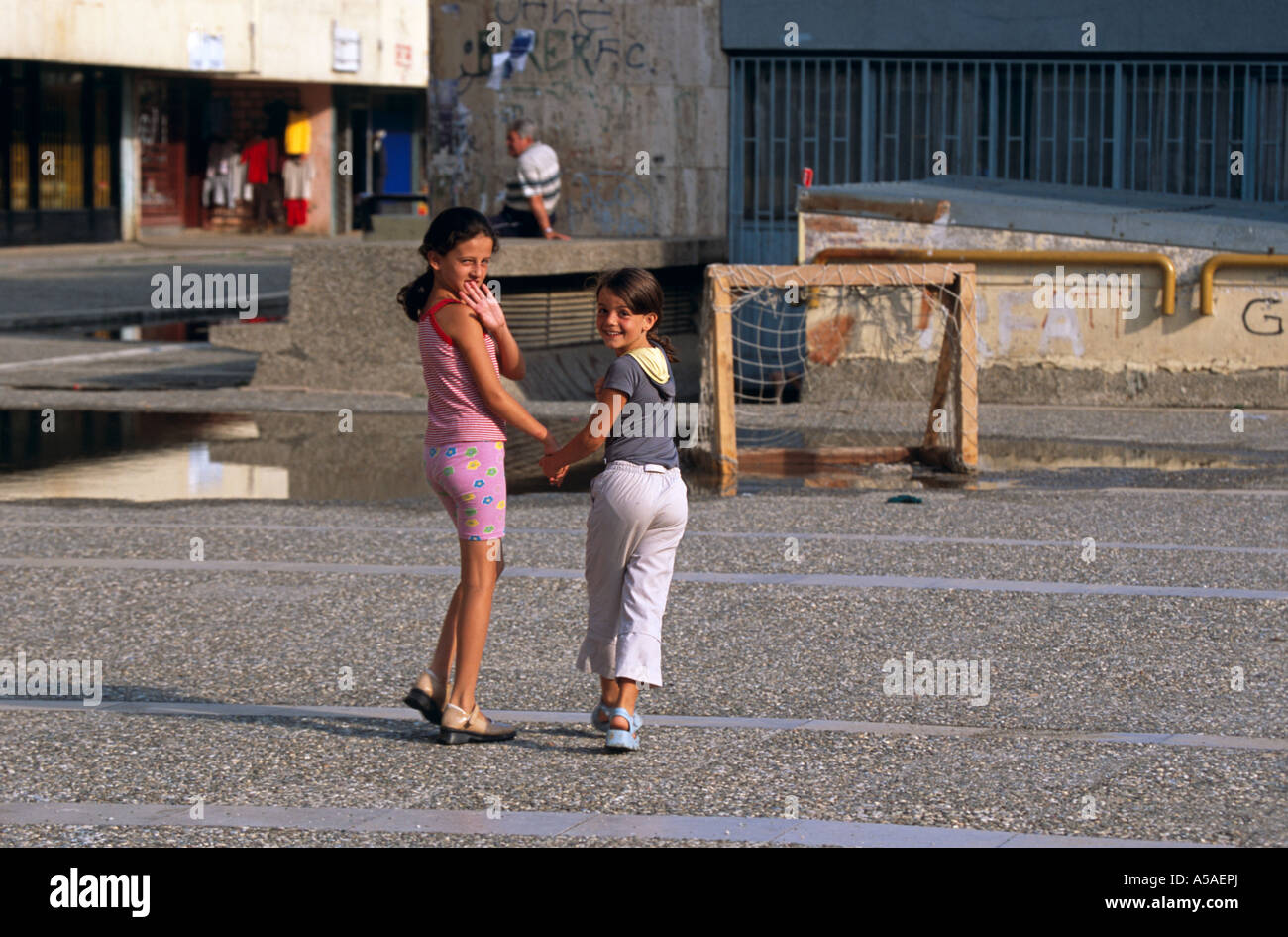Girls crossing the road in Kosovo Serbia Stock Photo Alamy
