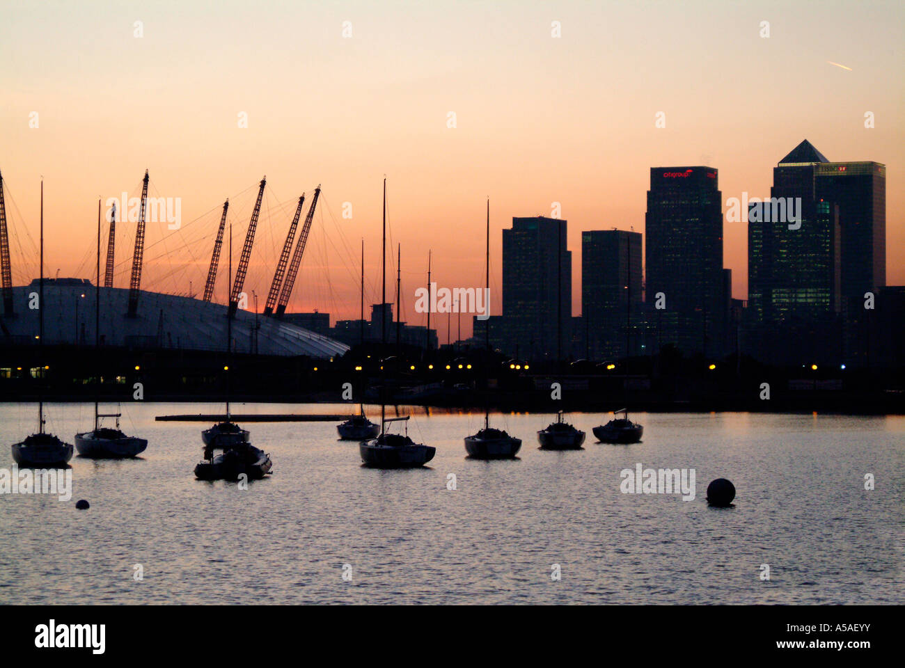 The O2 Dome and city buildings at sunset in Docklands London Stock ...