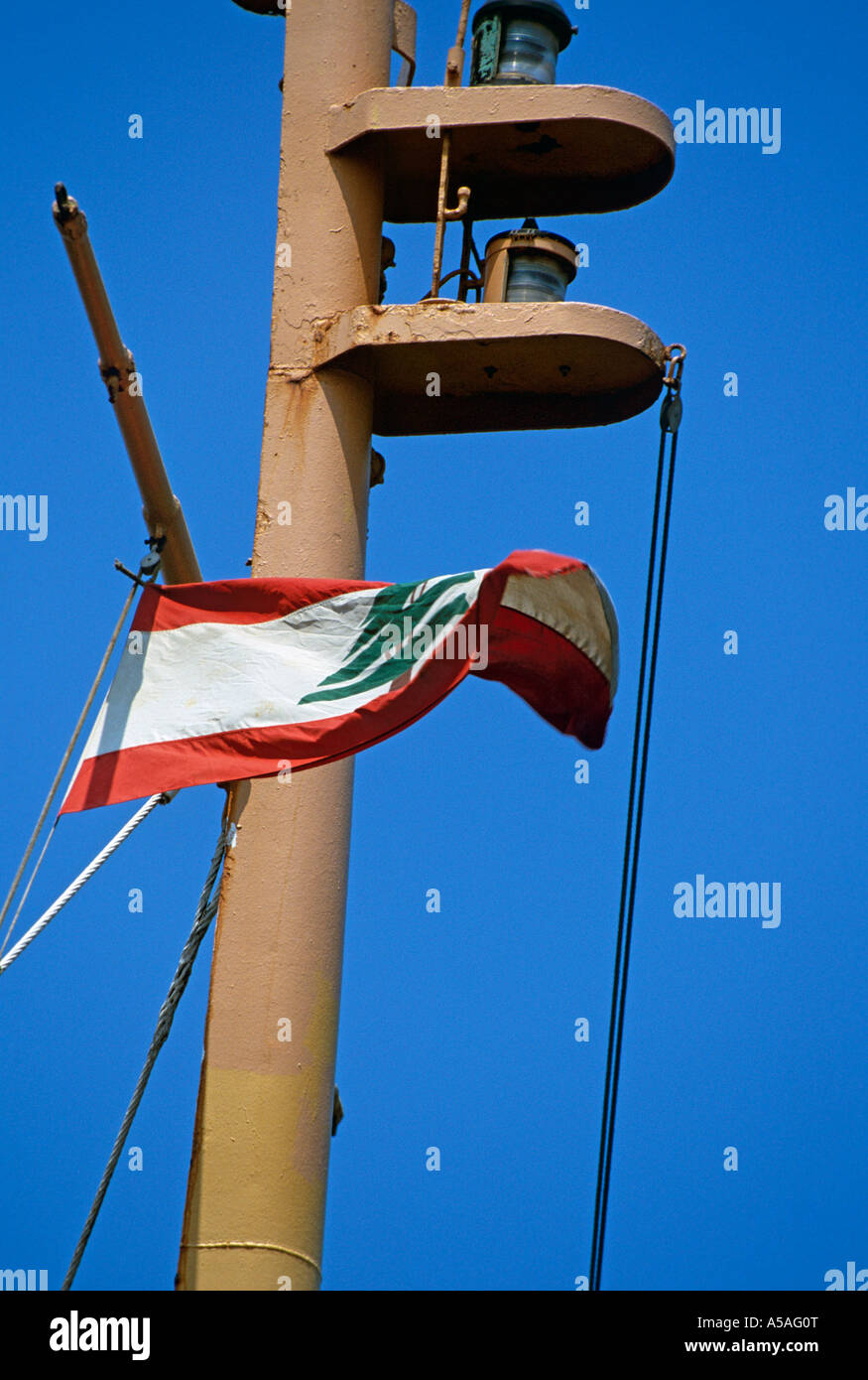 The flag of Lebanon flying on a ship in the Port of Beirut Lebanon Stock Photo