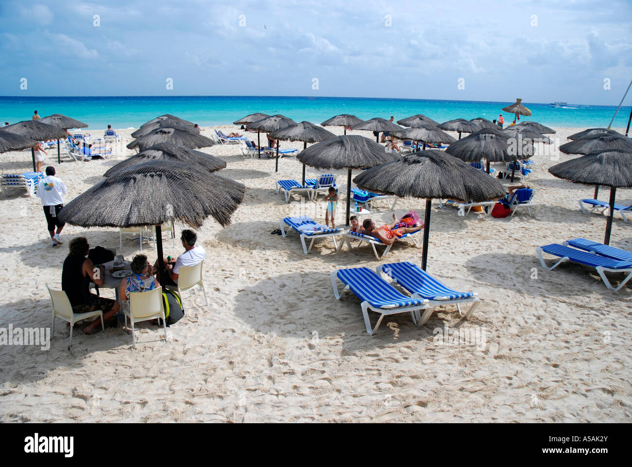 Mamita's beach club is one of many beach clubs along the beach in Playa del  Carmen where you can rent a sunchair or order food Stock Photo - Alamy, image size:1300x960