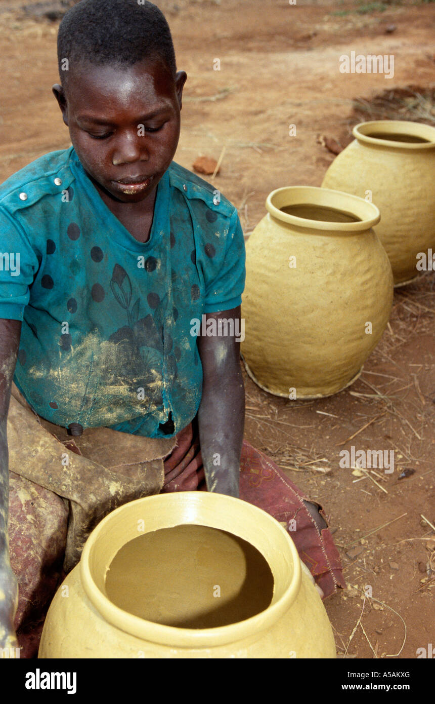 A girl making pots in Western Uganda Africa Stock Photo Alamy