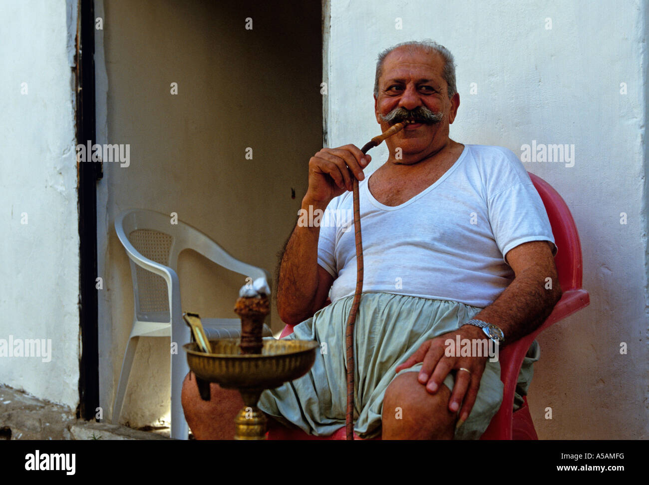 An elderly man smoking hookah in Beirut Lebanon Stock Photo 11252595