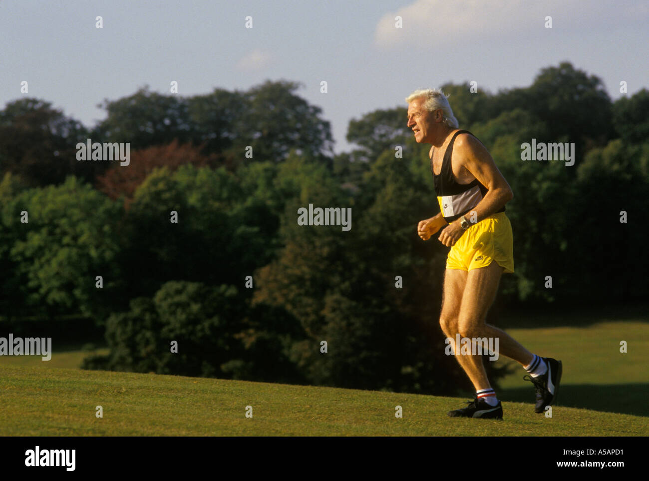 Jimmy Saville training in Roundhay Park, Leeds,Yorkshire UK His apartment overlooked the park. 1980s HOMER SYKES Stock Photo