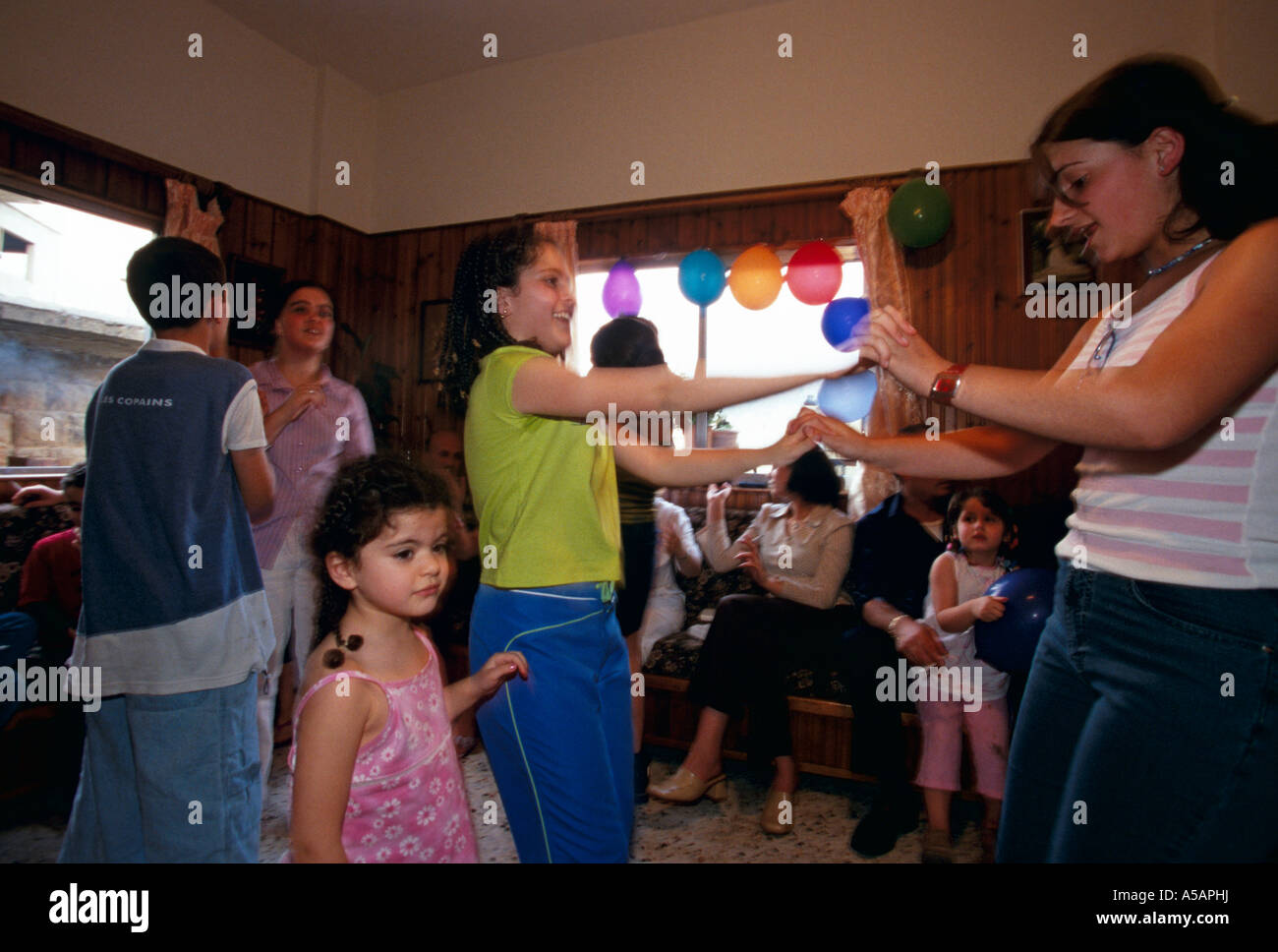 People dancing at a birthday party in Beirut Stock Photo