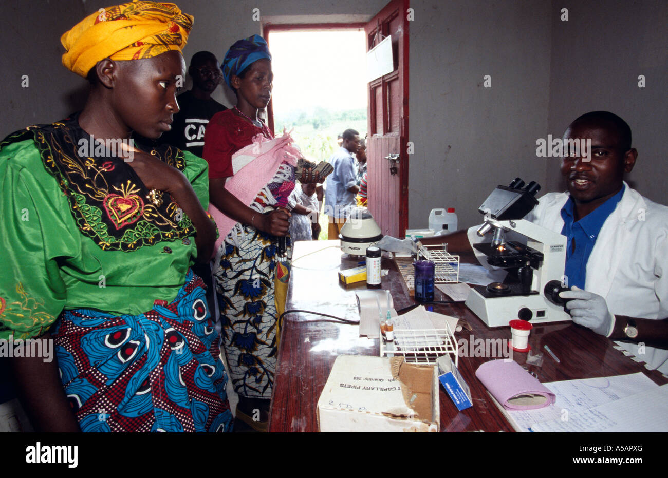 Doctor treating patients at health clinic, Kampala, Uganda Stock Photo