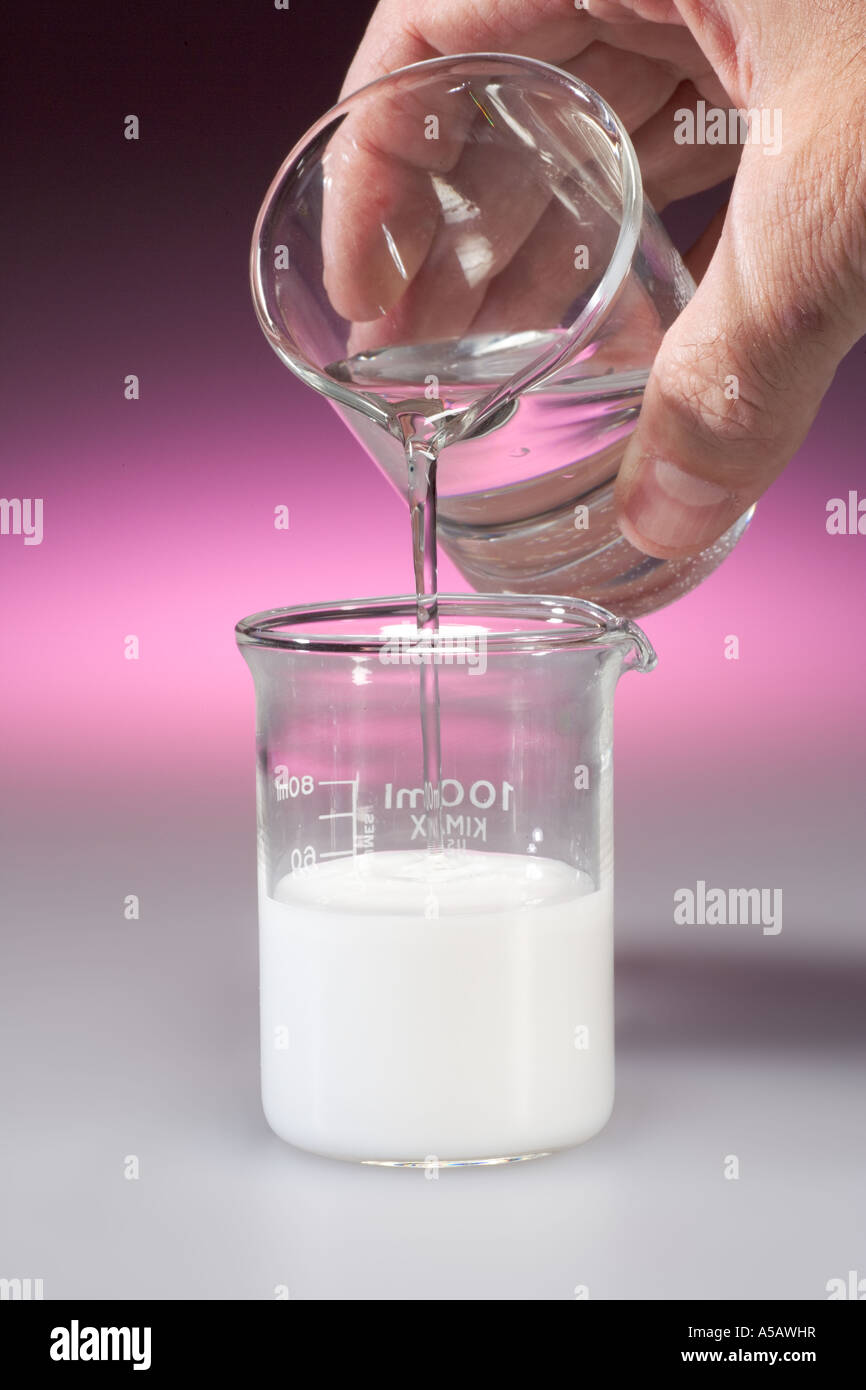 Adding Hydrochloric Acid to Milk of Magnesia in Beaker Pic 1 of 2 Stock Photo