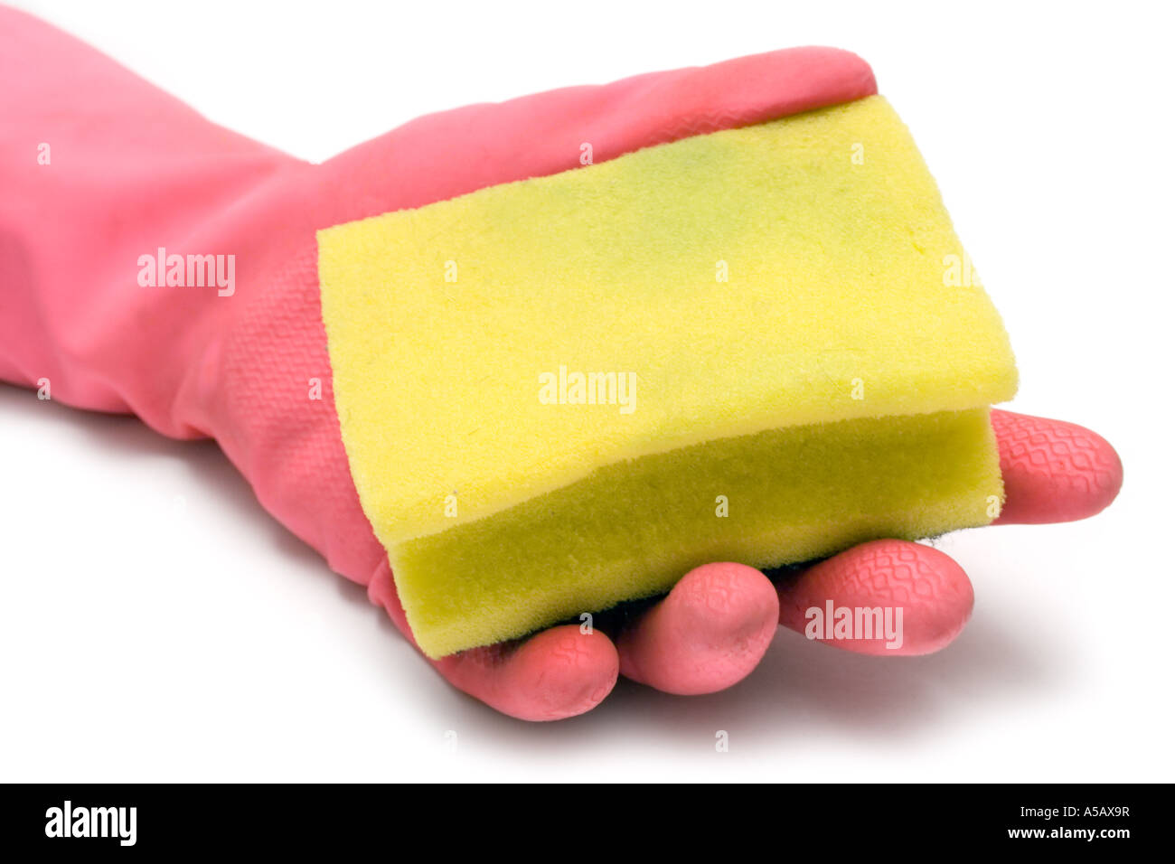 Pink gloves and a yellow cleaning sponge isolated on a white background. Stock Photo