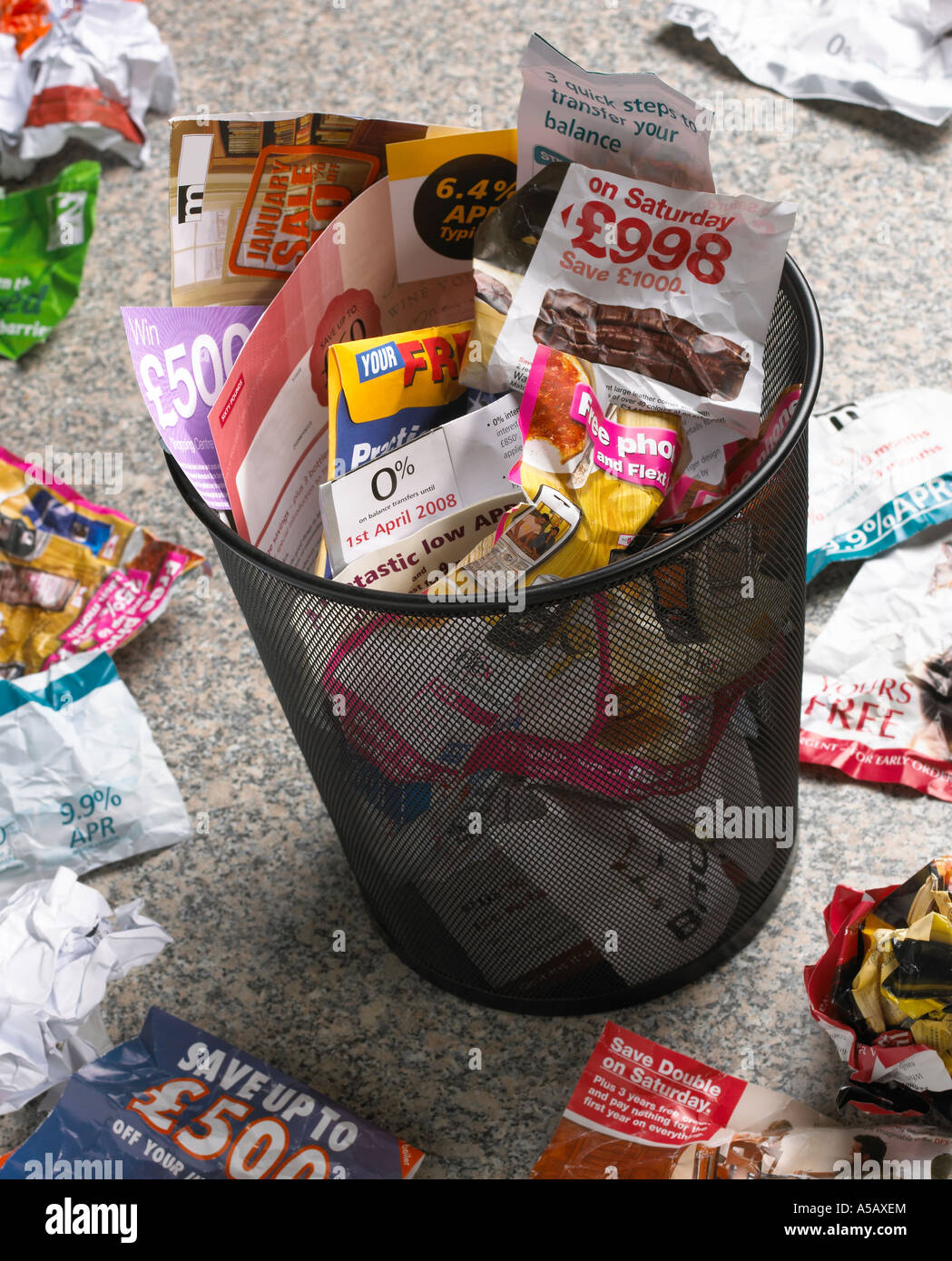 WASTE PAPER BIN FULL OF UNWANTED JUNK MAIL Stock Photo