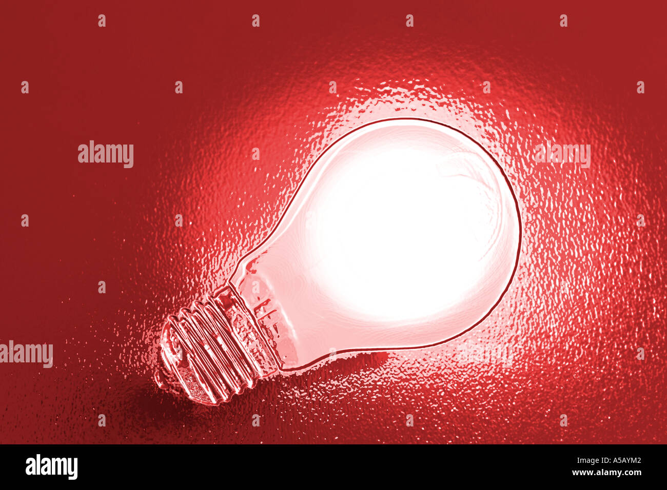 Chrome effect electric light bulb on red background Stock Photo