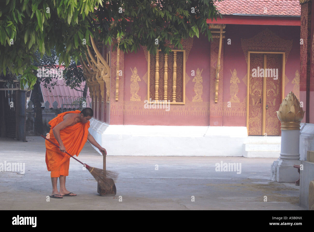 Morning chores at a Buddhist temple, Laos Stock Photo - Alamy