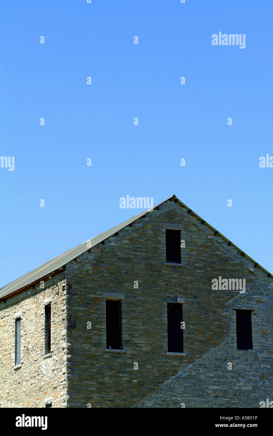Old brick house under a blue sky Stock Photo - Alamy