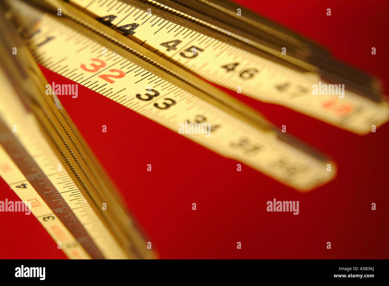 Wooden measuring sticks with numbers. Stock Photo