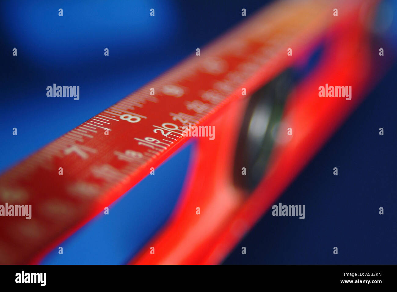 Red level and ruler combination tool. Stock Photo