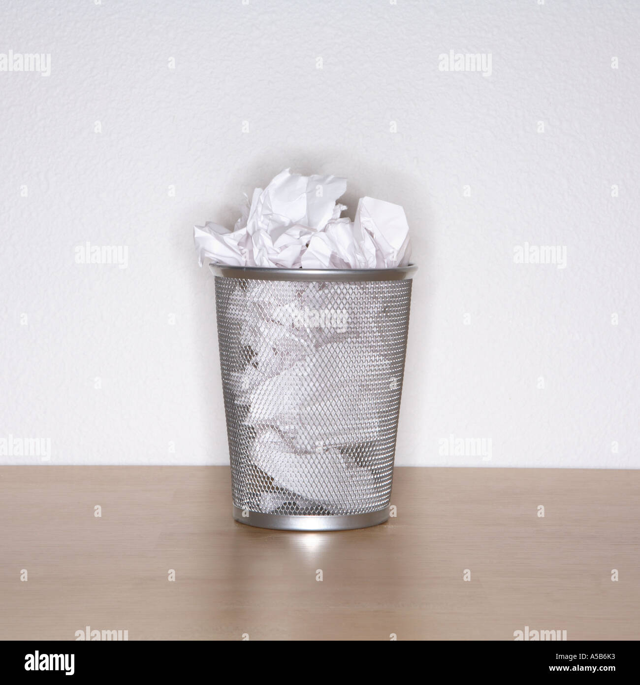 Waste Basket full of paper Stock Photo Alamy
