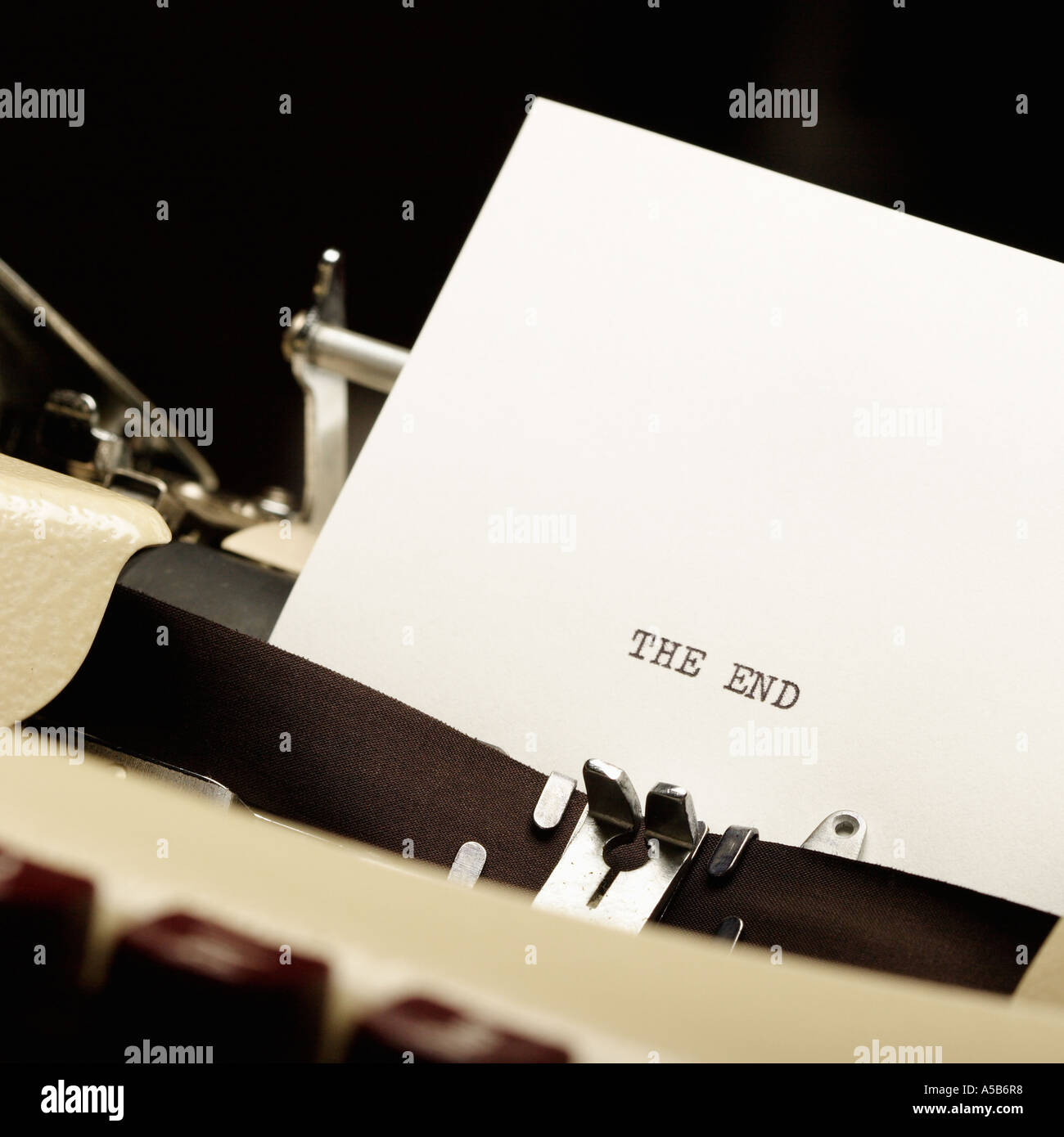 Detail of typewriter and piece of paper with writing The End Stock Photo