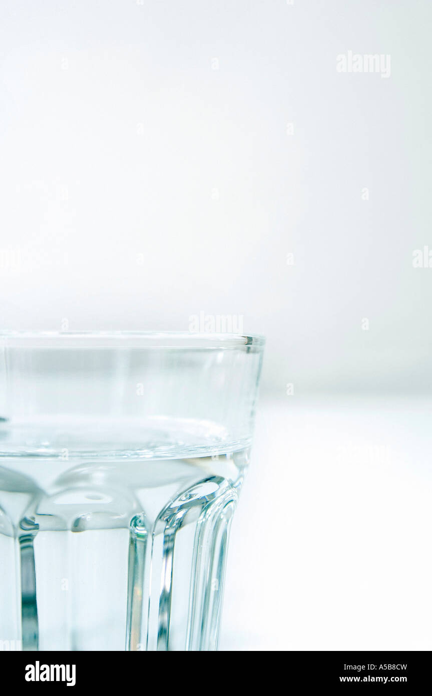 Clear glass tumbler of water on white Stock Photo Alamy