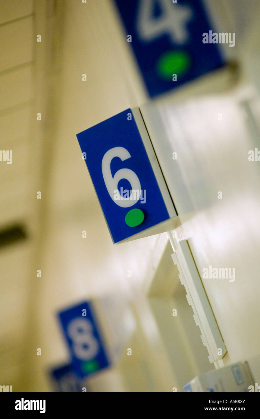 Numbers above hospital emergency examination rooms Stock Photo Alamy