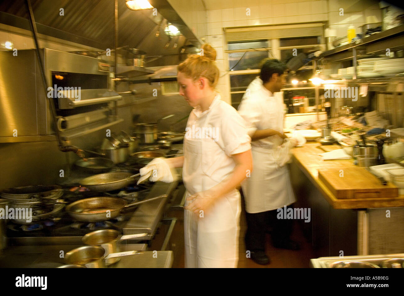 Team of restaurant kitchen staff busy at work Stock Photo Alamy
