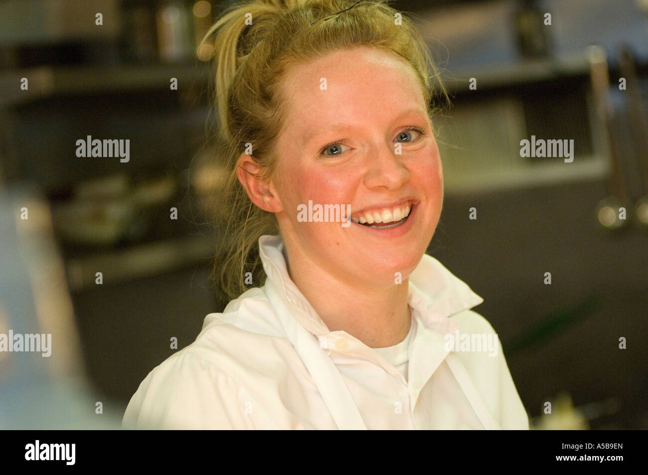 Portrait of female chef in restaurant kitchen Stock Photo - Alamy