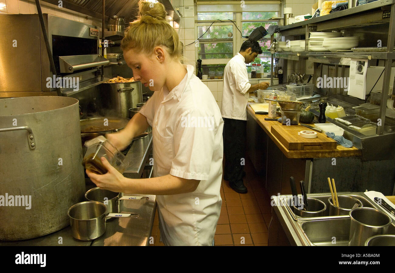 Team of restaurant kitchen staff busy at work Stock Photo - Alamy