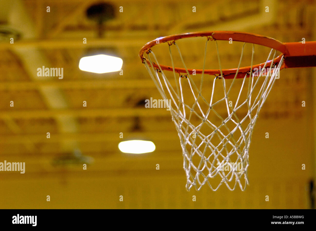 Empty basketball net in gymnasium Stock Photo Alamy
