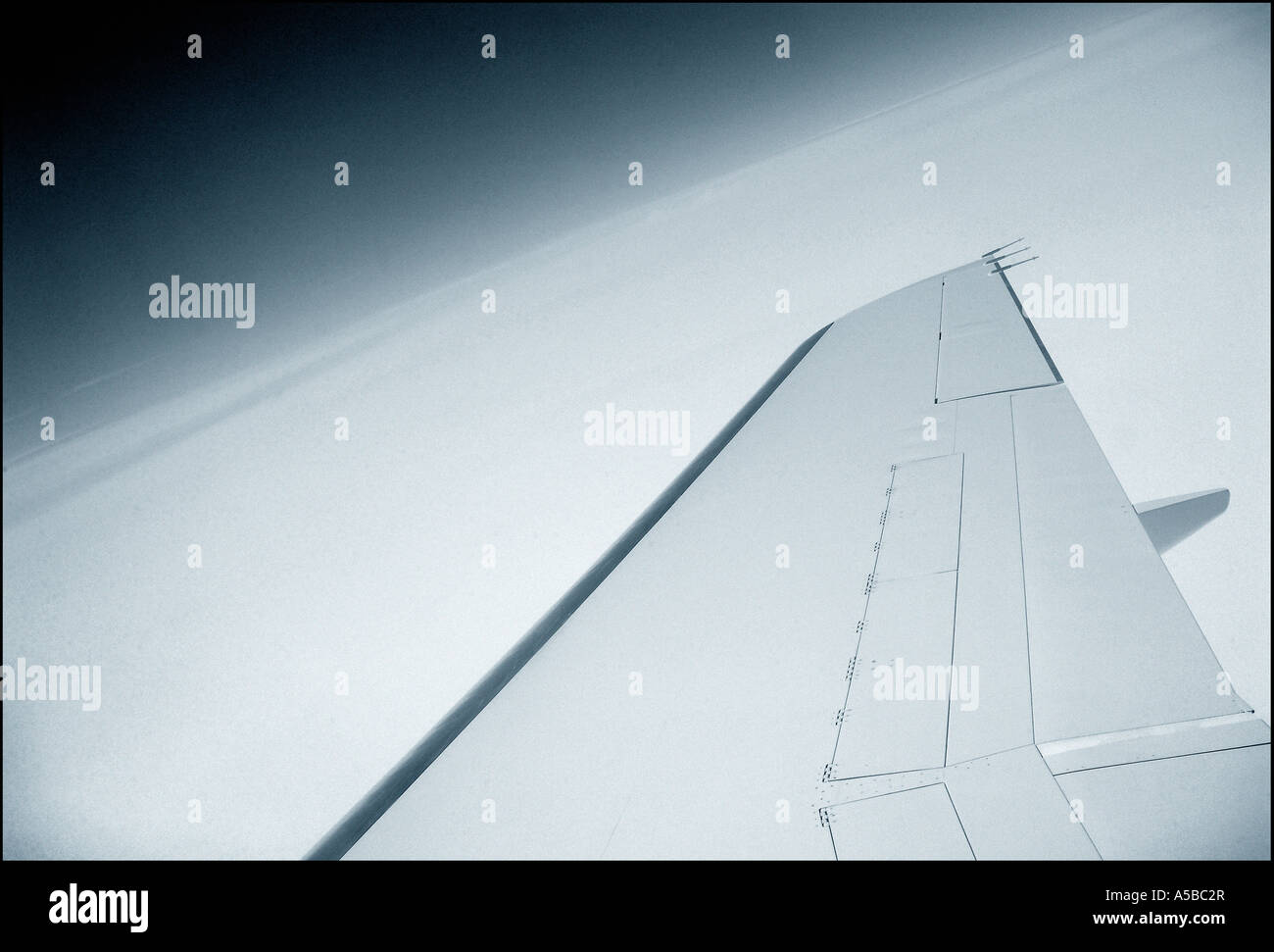 Private jet wing above the clouds Stock Photo Alamy