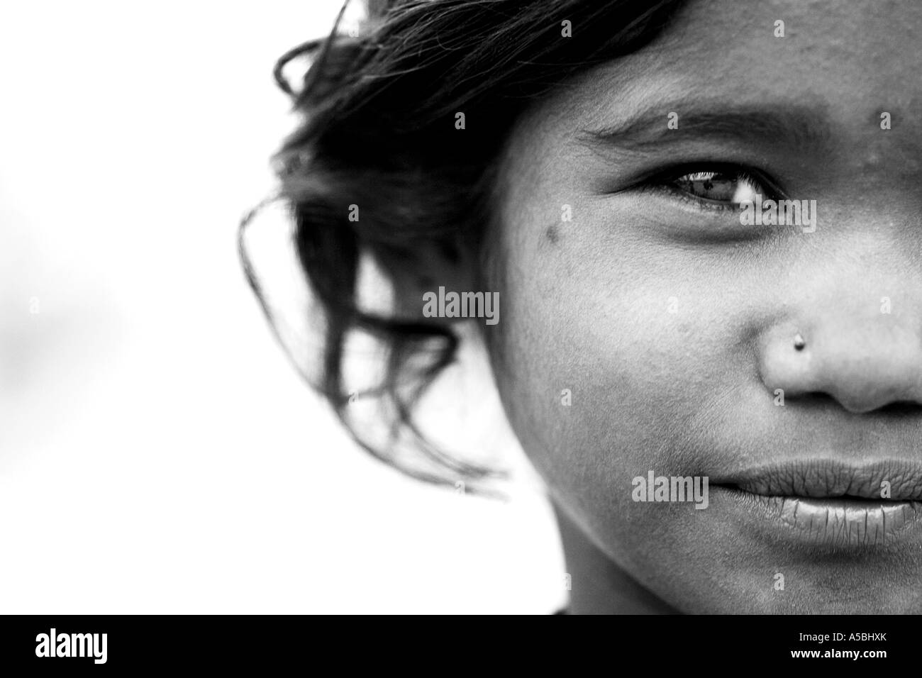 Close up portrait of a young Indian street girl. Andhra Pradesh, India. Black and white Stock Photo