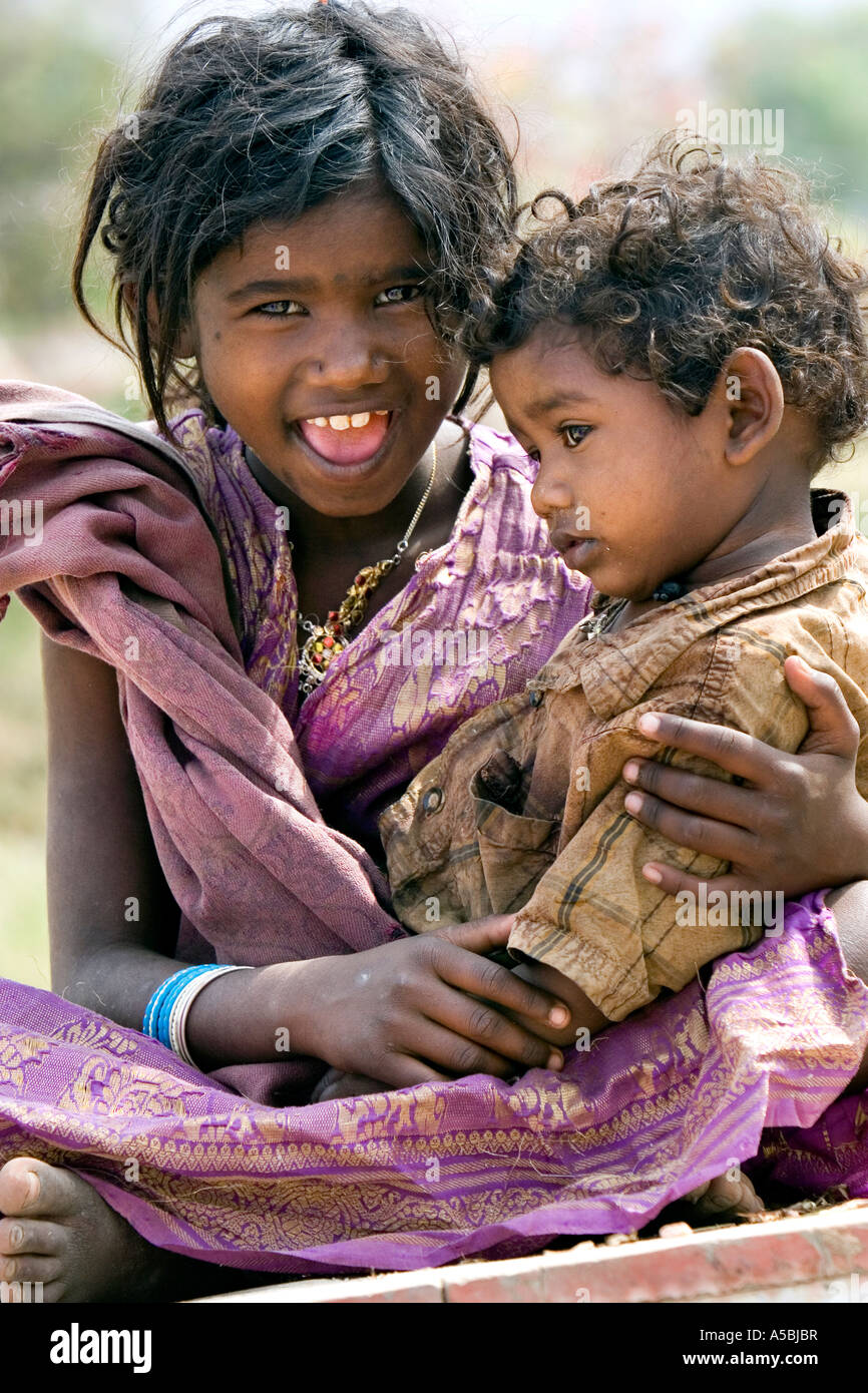 Girl baby sister sitting lap hires stock photography and images Alamy