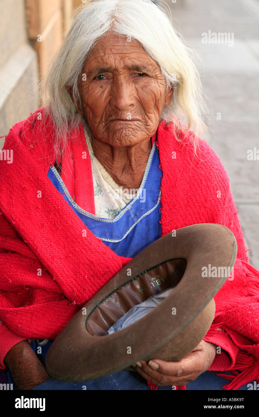 Beggar Woman on Sidewalk Sucre Bolivia Stock Photo