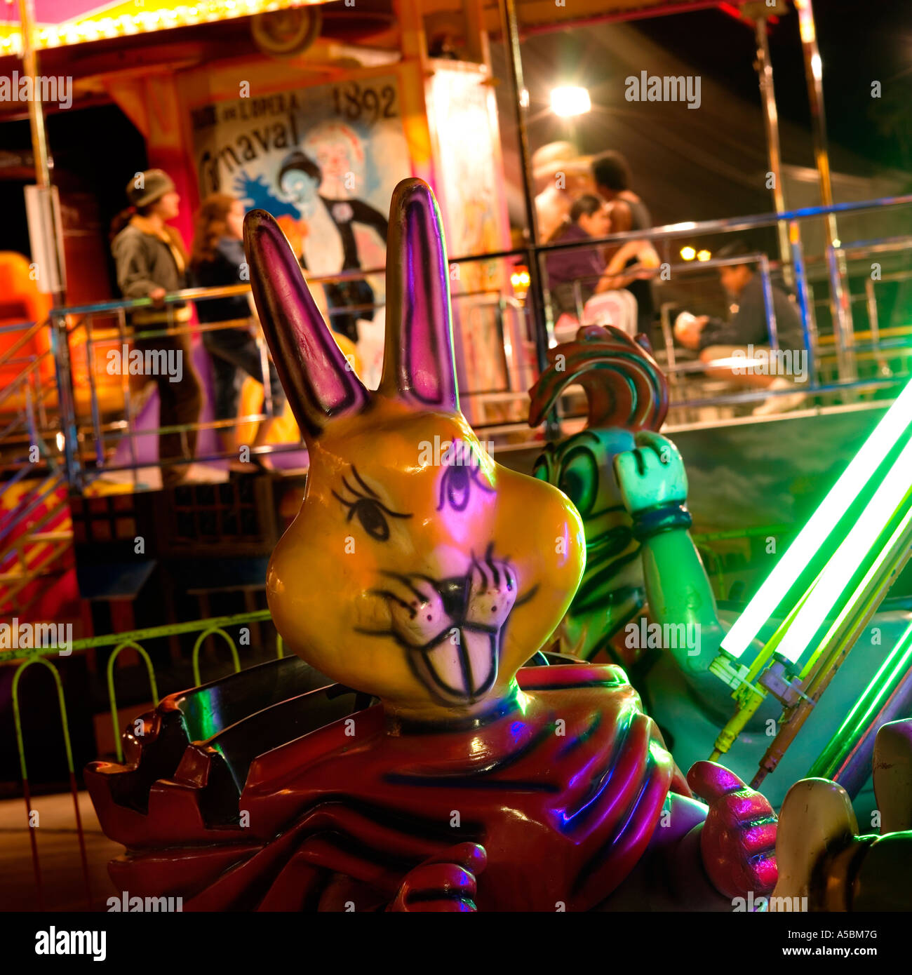 Night time rabbit ride at fairground surreal weird unusual image concept greeting card idea Stock Photo