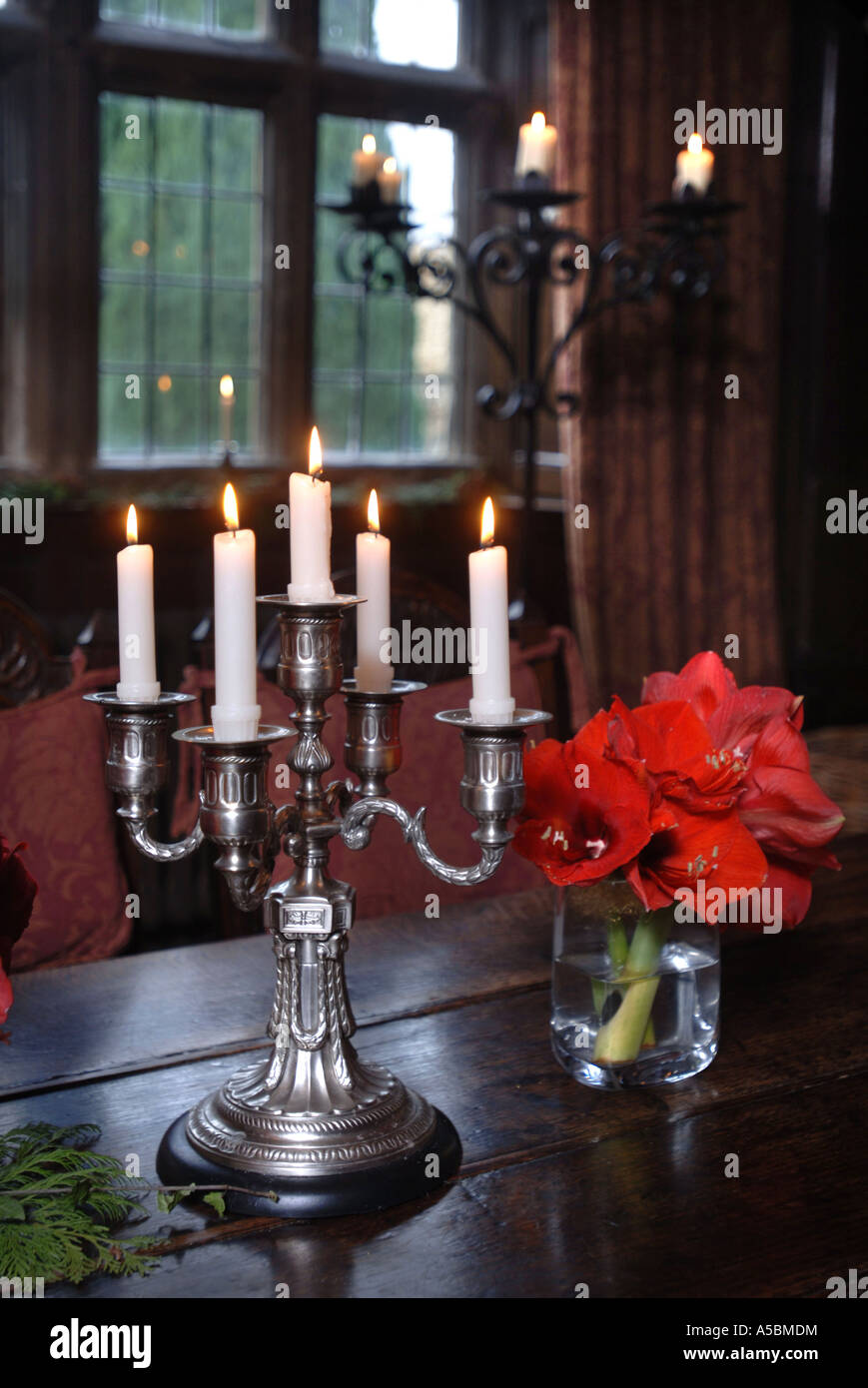 A FIVE BRANCHED TABLE CANDELABRUM WITH A COLUMN OR PEDESTAL CANDELABRA