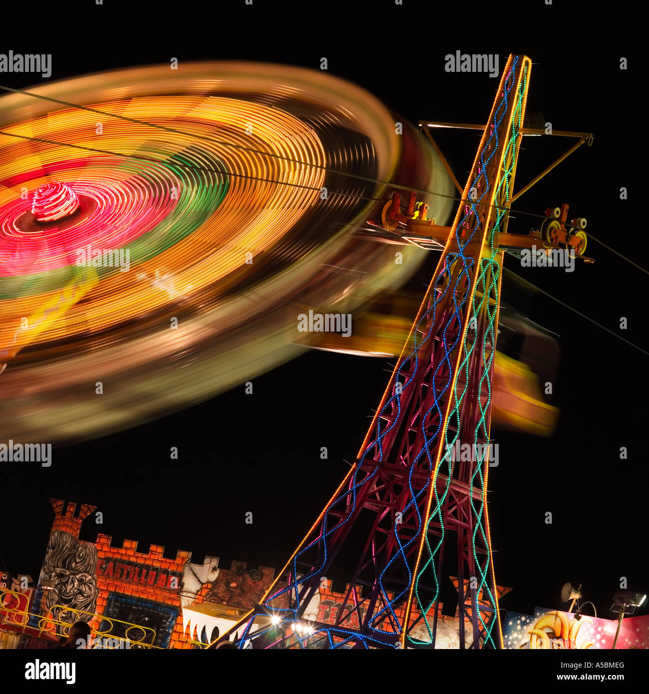 fairground ride the spinning wheel in action surreal weird unusual image concept greeting card idea Stock Photo
