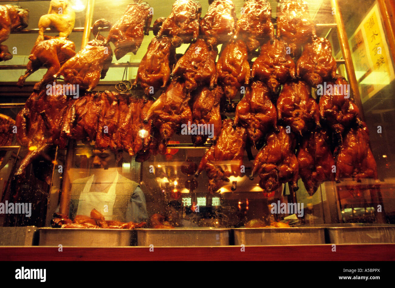 Peking ducks in a restaurant window at chinatown Gerrard Street Soho