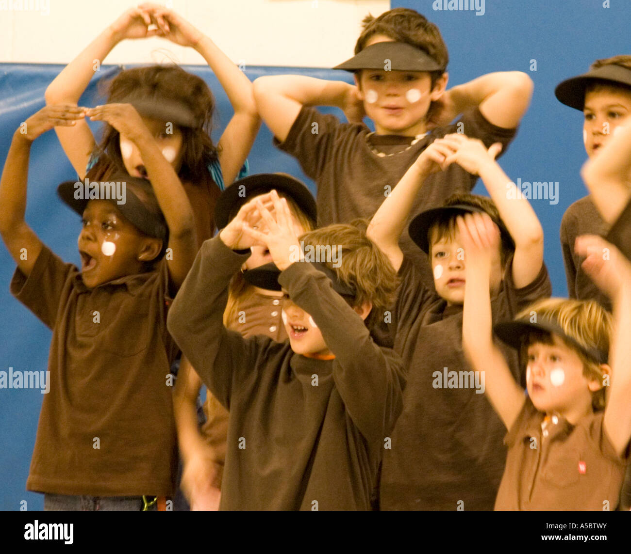 Racially diverse students age 6 performing in musical production. Horace Mann Elementary School St Paul Minnesota USA Stock Photo