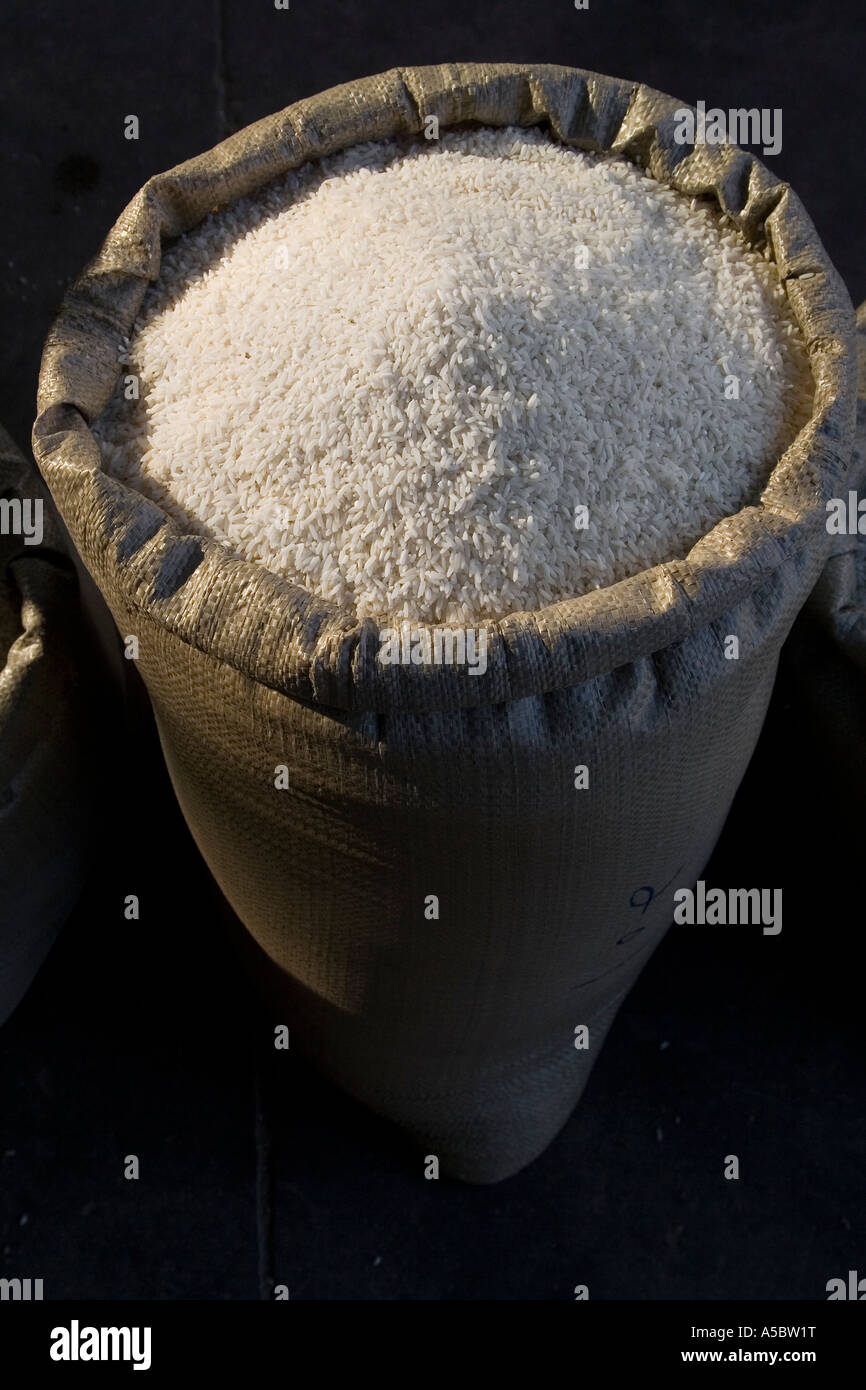 Bags of Uncooked White Rice for Sale at Market Menghai China Xishuangbanna Stock Photo