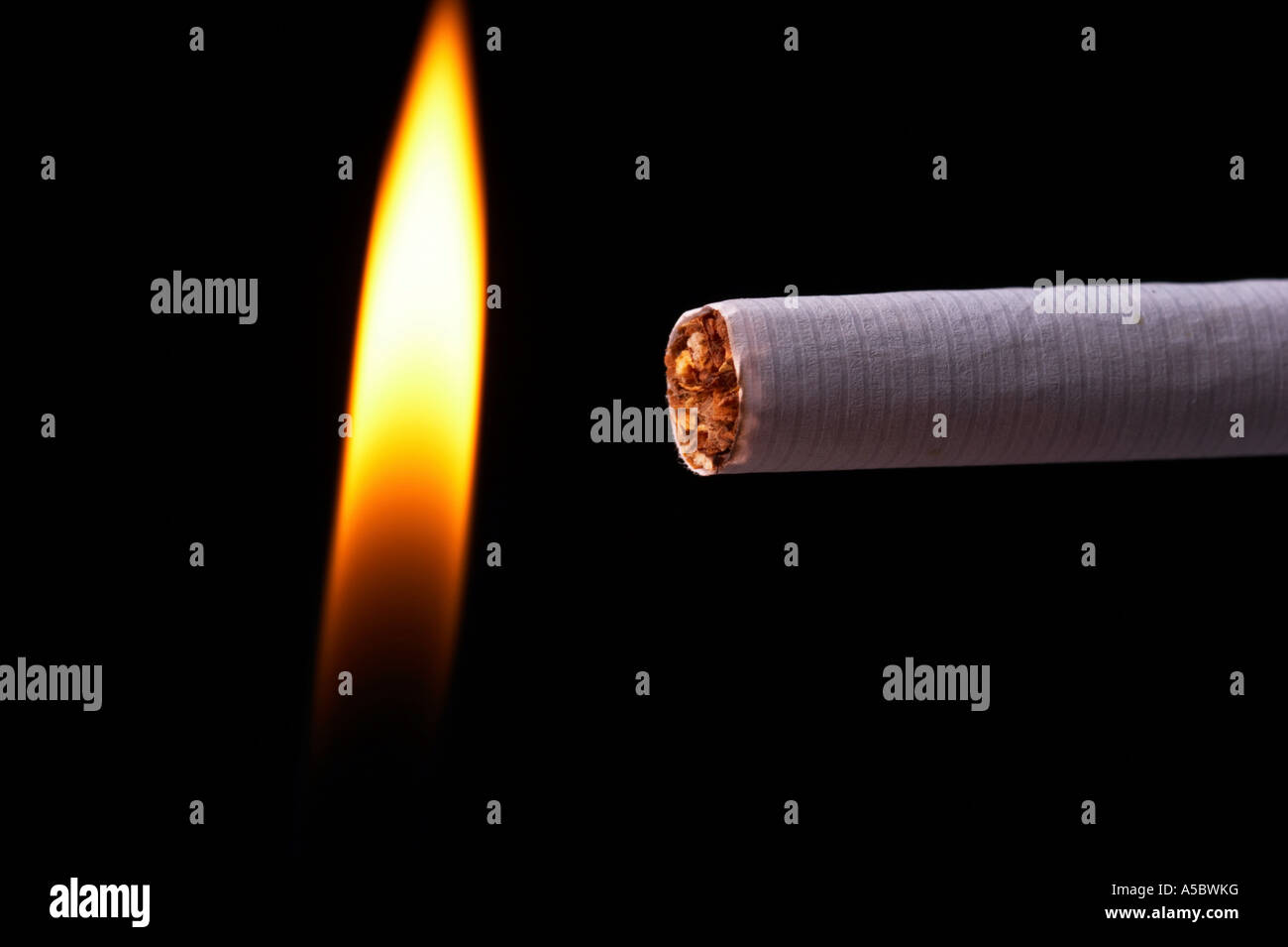 Light a cigarette with a match, black background Stock Photo Alamy