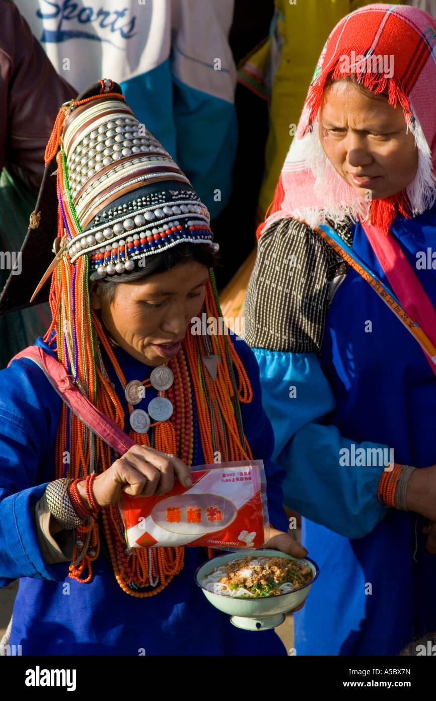 Akha Woman Adding MSG To Soup Xiding Market Xishuangbanna China Stock Akha Woman Adding MSG To Soup Xiding Market Xishuangbanna China Stock
