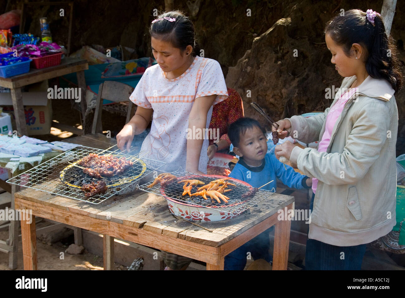 Chicken Feet and Sate on the Grill Luang Prabang Laos Stock Photo