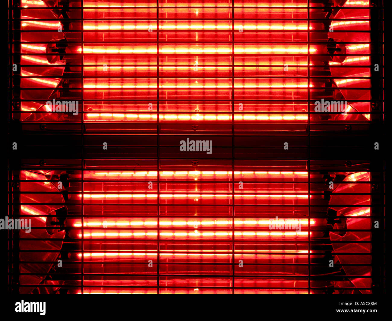 Elements of a heater glowing red to give an impression of warmth, Stock Photo