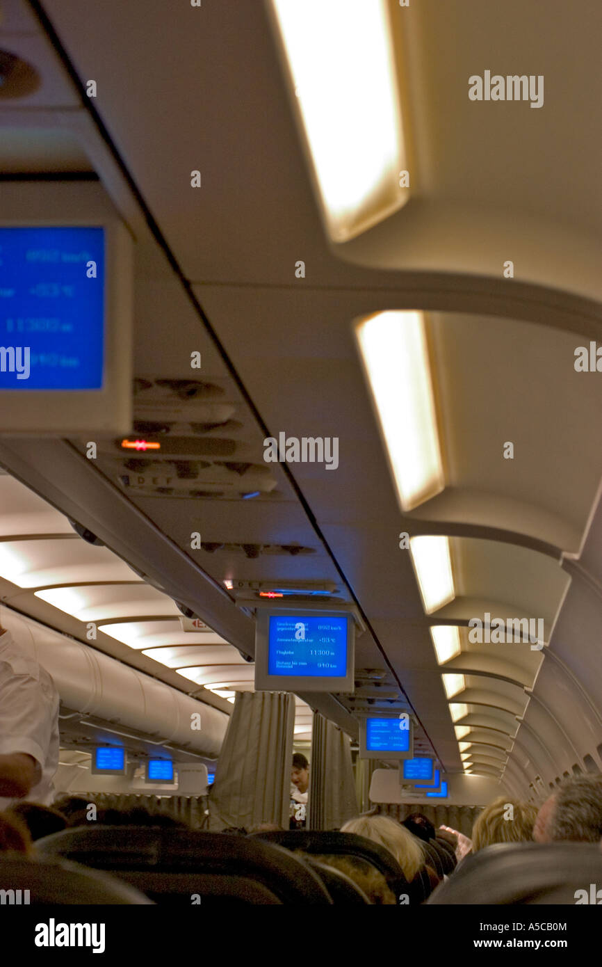inside airplane and mini tv monitor Stock Photo