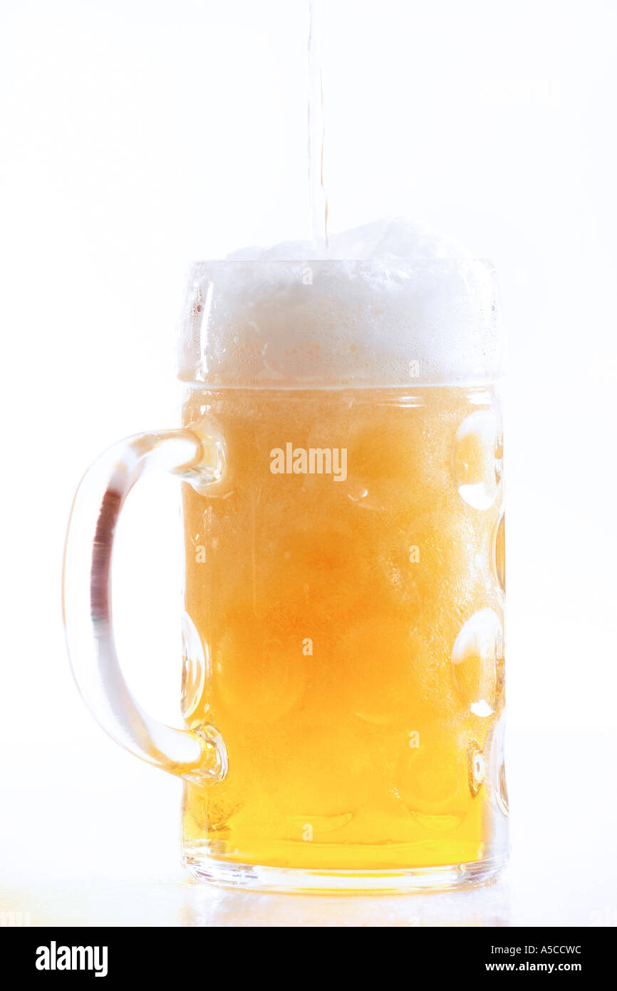 Pouring beer into glass, close-up Stock Photo