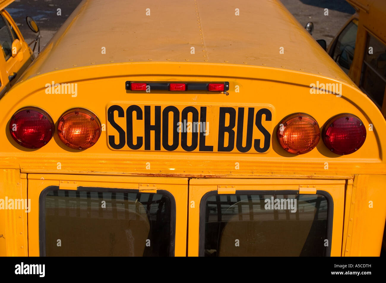 low angle closeup of schoolbus lights and sign Stock Photo Alamy