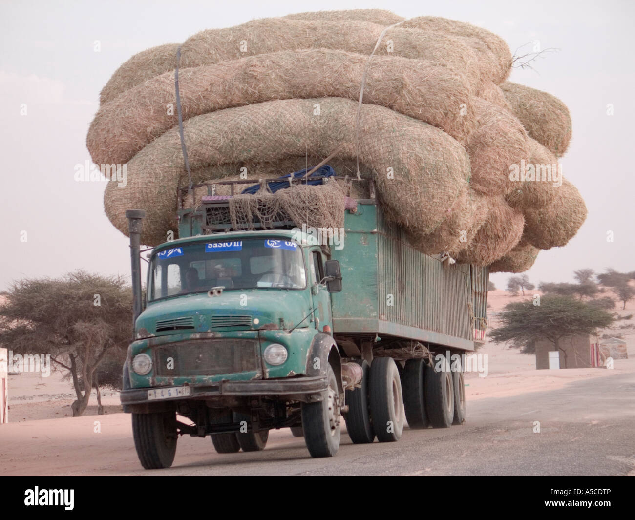 Overloaded lorry in Mauritania, West Africa Stock Photo