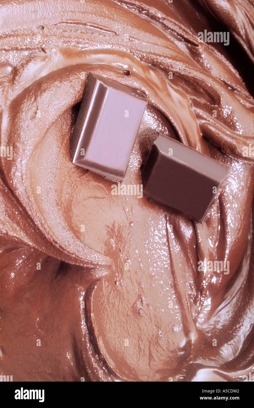 Chocolate chunks in melted chocolate, close-up Stock Photo