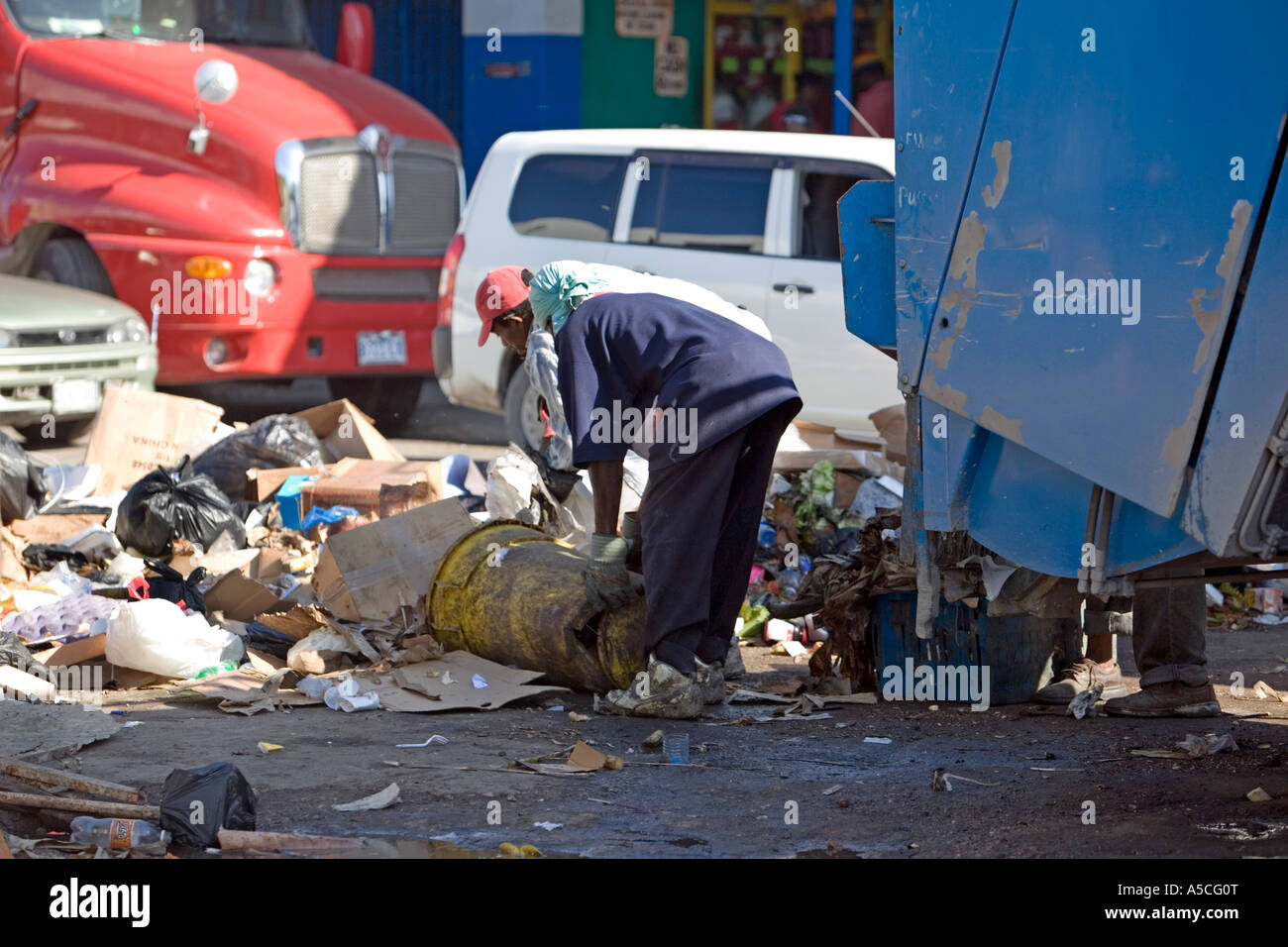 Jamaica man collecting in garbage Stock Photo Alamy